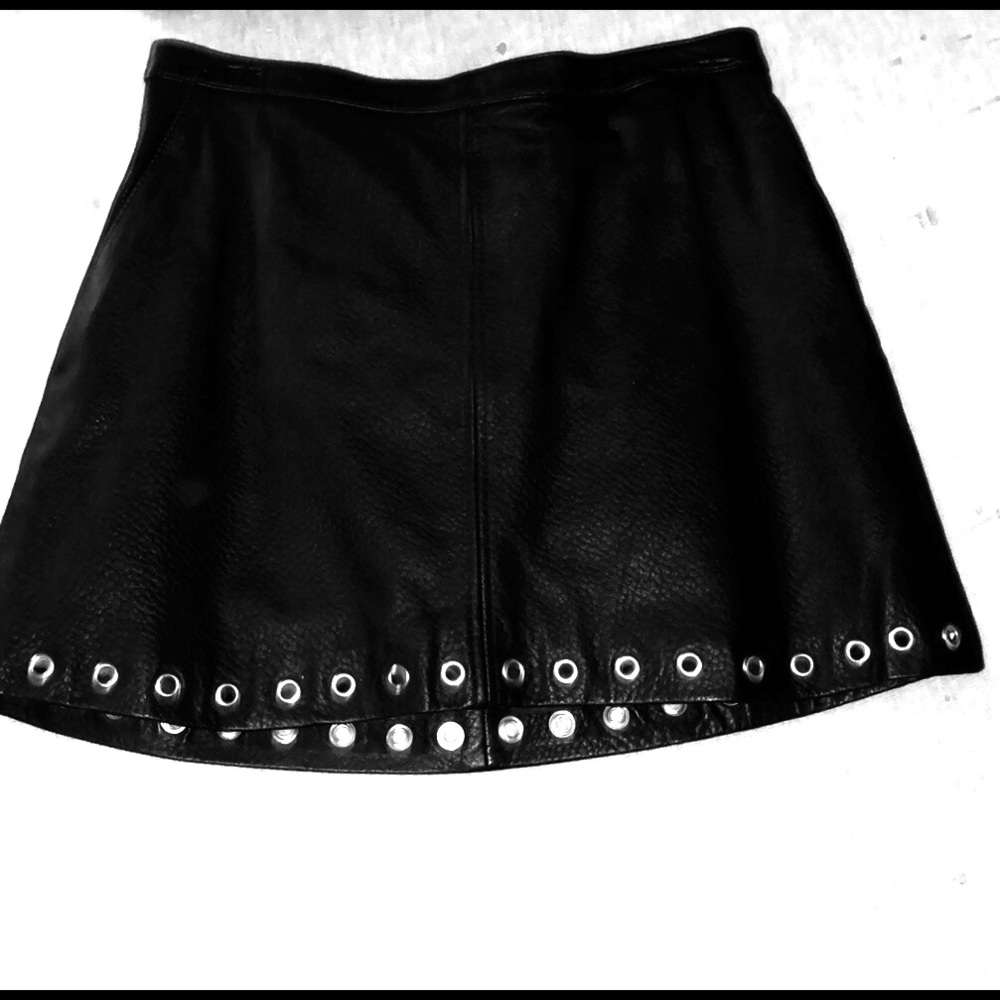 H and M  Leather skirt with silver grommet trim.